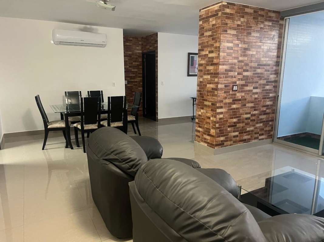 Dining room with city view windows, glass table at PH Pacifica Tower San Francisco Panama
