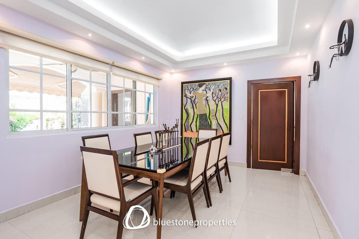 Kitchen with granite countertops, white cabinets, stainless steel appliances Costa del Este Panama luxury house