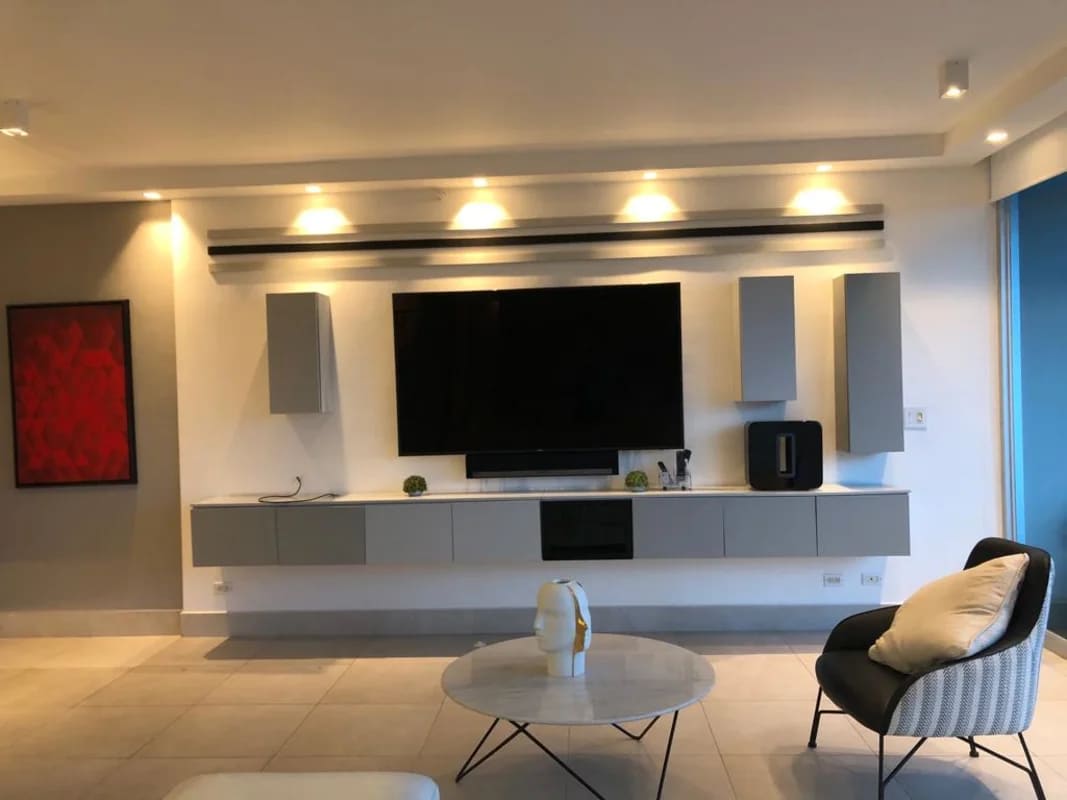 Modern living room with large windows and city view at PH Pacific Hills Dos Mares Panama