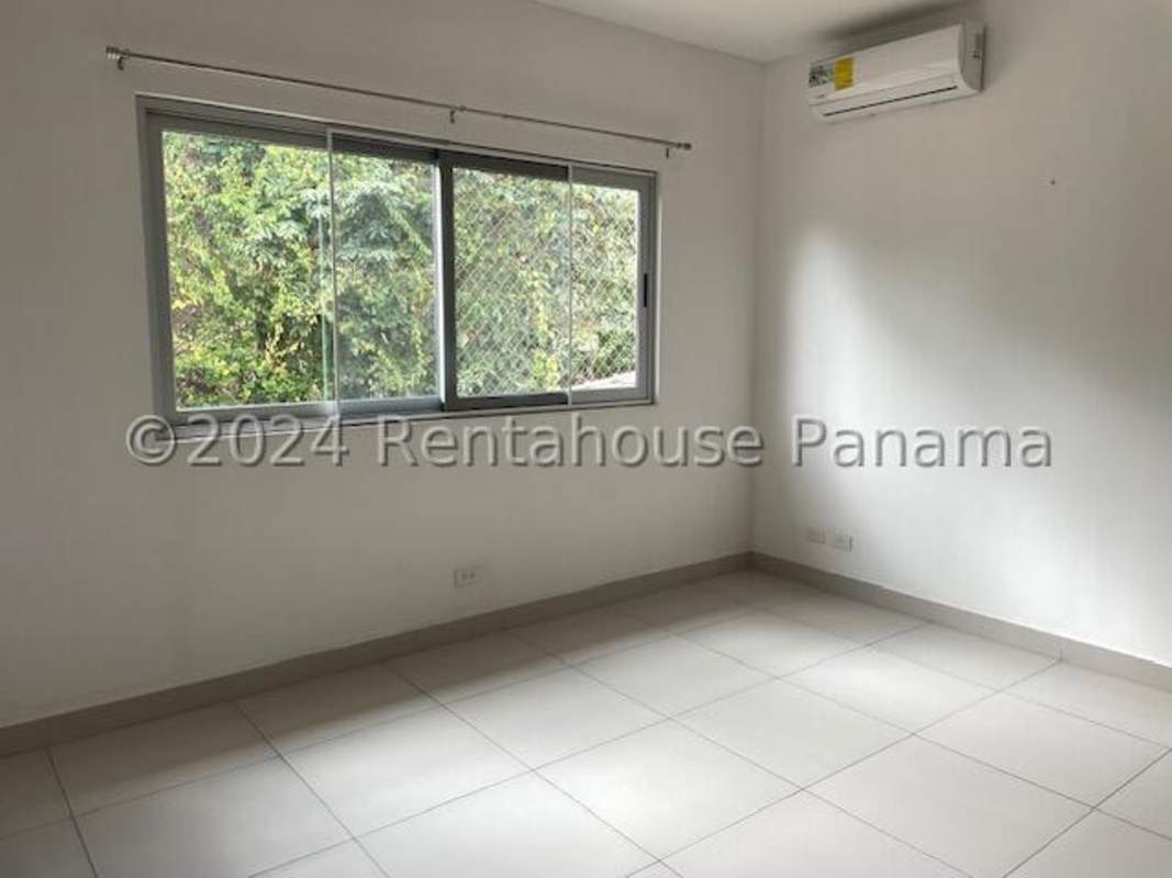 Bright bedroom with balcony access, tiled flooring and ensuite bathroom in Condado del Rey