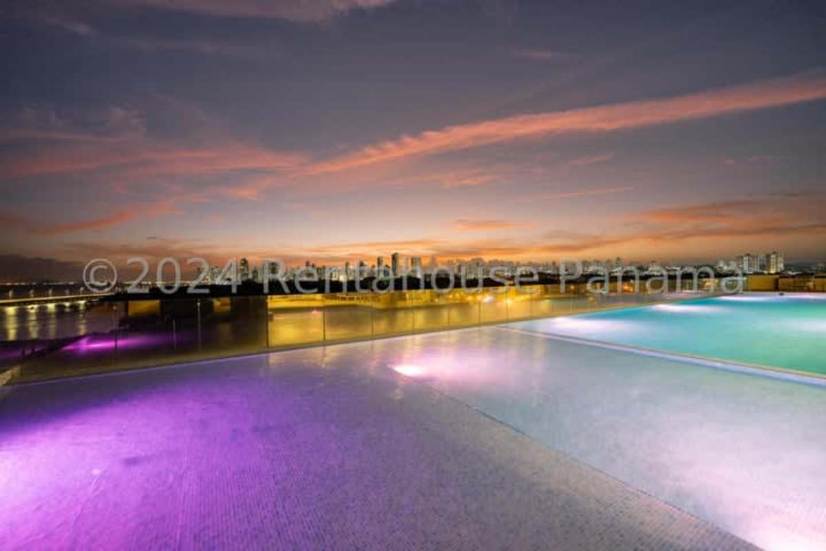 Rooftop infinity pool sunset views over ocean Kai Residences Costa del Este Panama