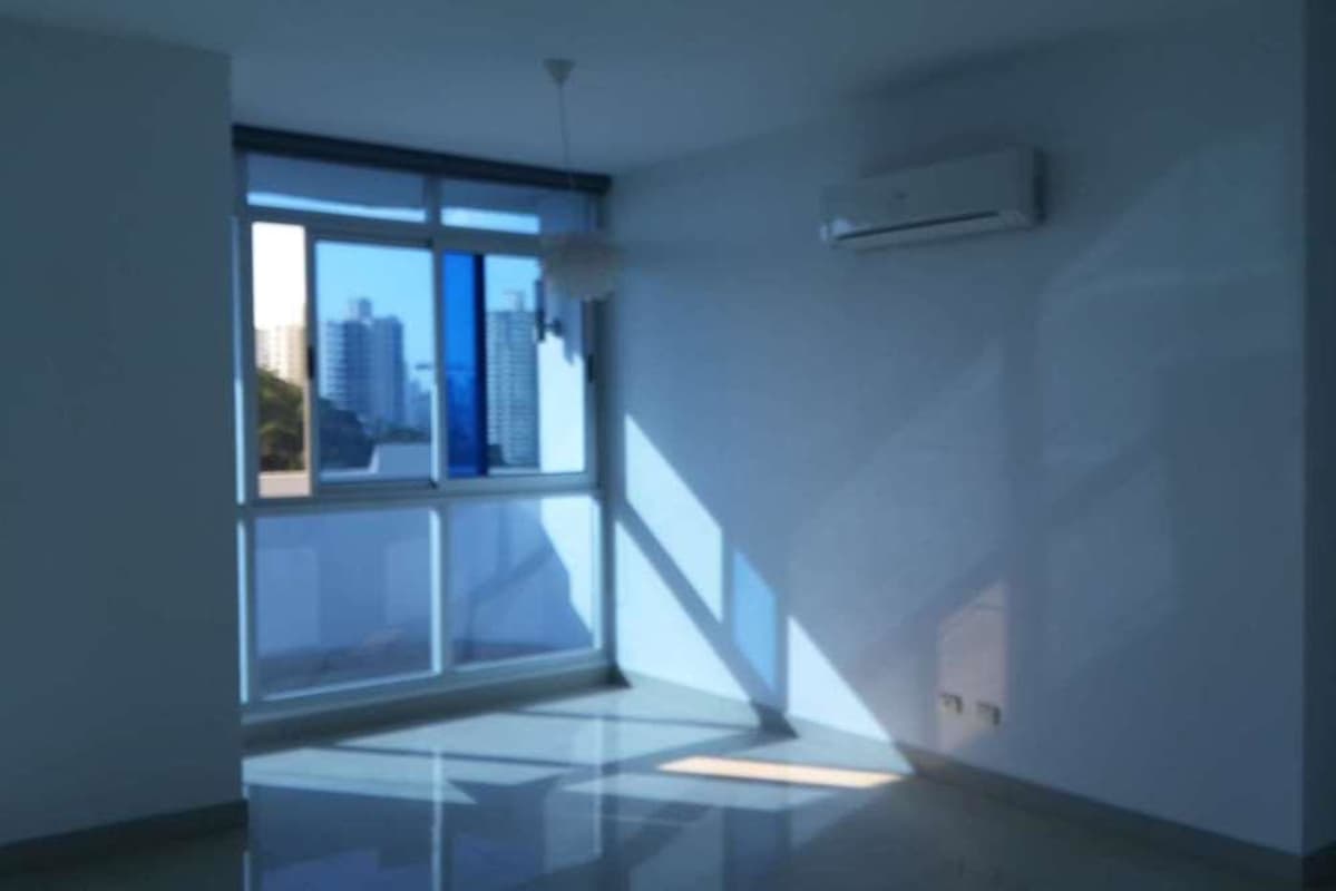 Living room in PH Yoo Panama with panoramic windows and city views