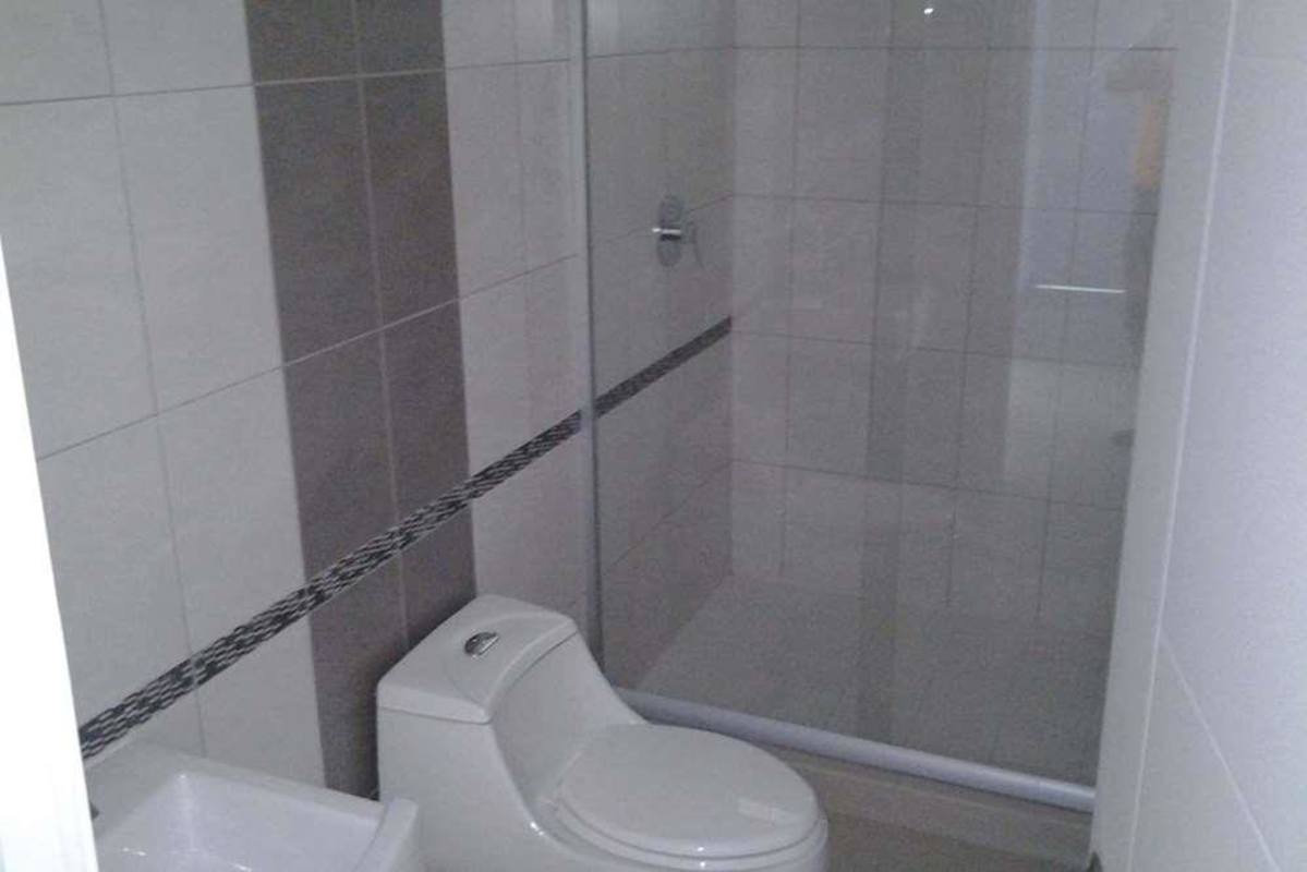 Bathroom with glass shower, bidet, ceramic fixtures PH Yoo Bella Vista