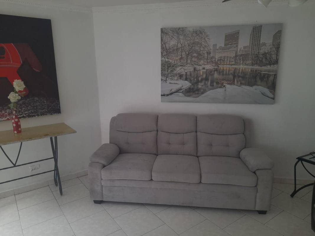 Dining room with tile floor, large windows and wood furnishings PH Coral Plaza Panama