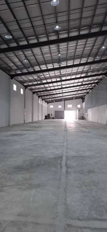 Spacious high ceiling interior warehouse empty floor Panama City near airport