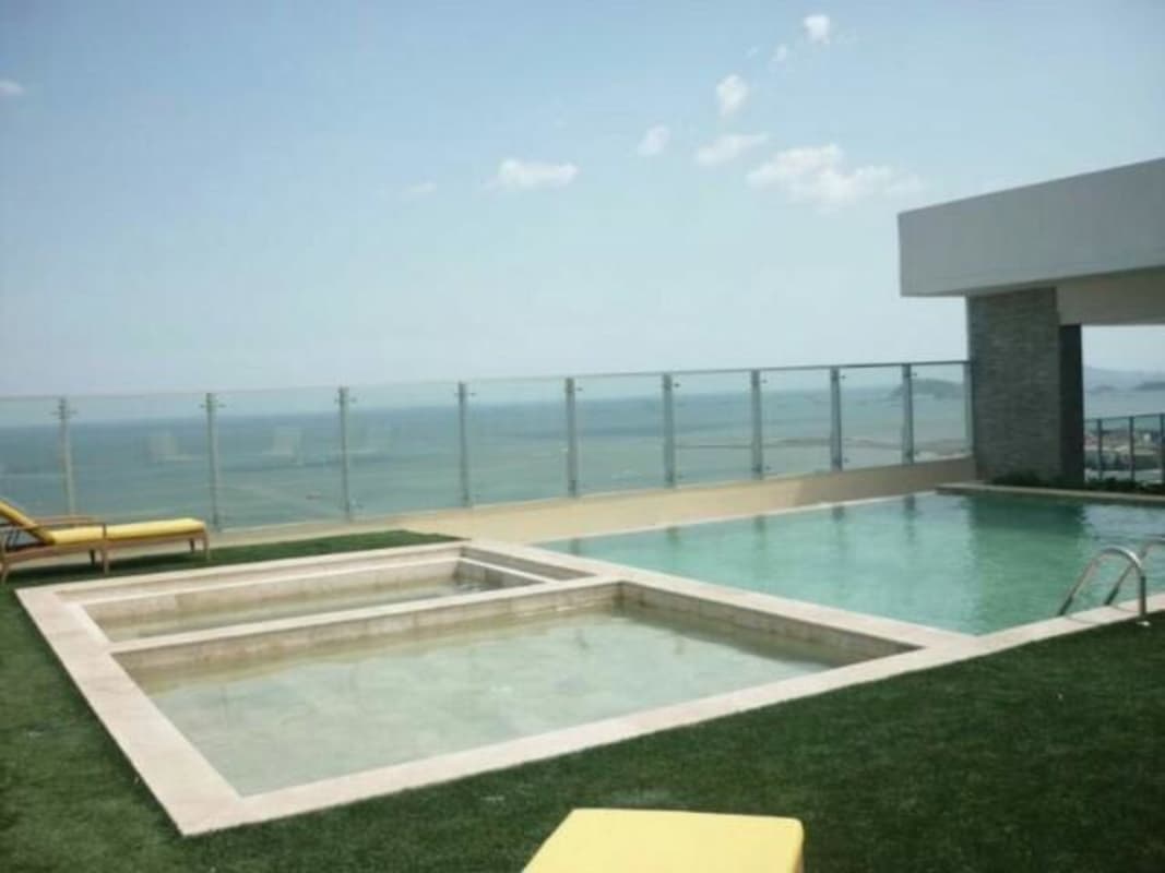 Infinity pool and jacuzzi on rooftop terrace with panoramic bay view PH Yacht Club Panama City