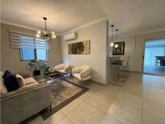 Open dining room connected to modern kitchen in furnished house Palmia Woodlands Panama Pacifico