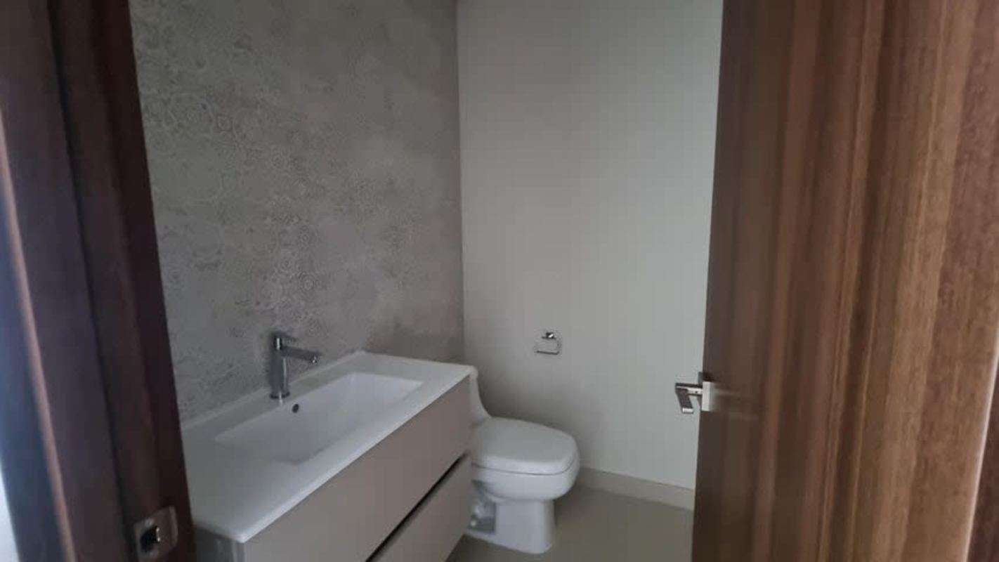 Modern bathroom with double sink vanity and glass shower at PH Costa del Este Exclusive Panama