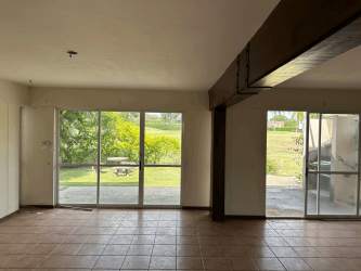 Open concept living and dining area with tiled floor inside golf resort townhouse at Royal Decameron Anton Panama