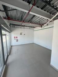 Industrial style commercial interior open space polished floors exposed ceiling