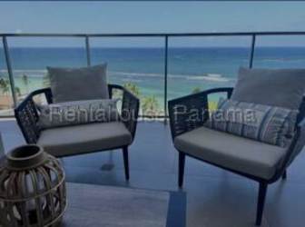 Modern gym with equipment and large windows overlooking Caribbean in Playa Escondida Panama