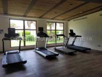 Living room with glass doors to balcony and ocean view in PH Playa Escondida Panama