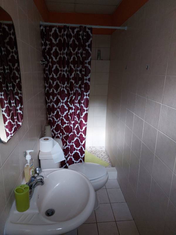 Secondary bedroom or office with window and closet in Villa Lucre Panama house