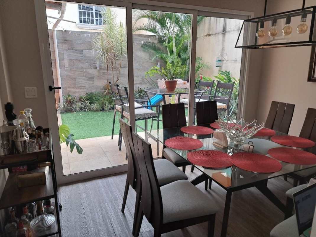 Dining area with access to garden and terrace in Villa Lucre duplex Panama City