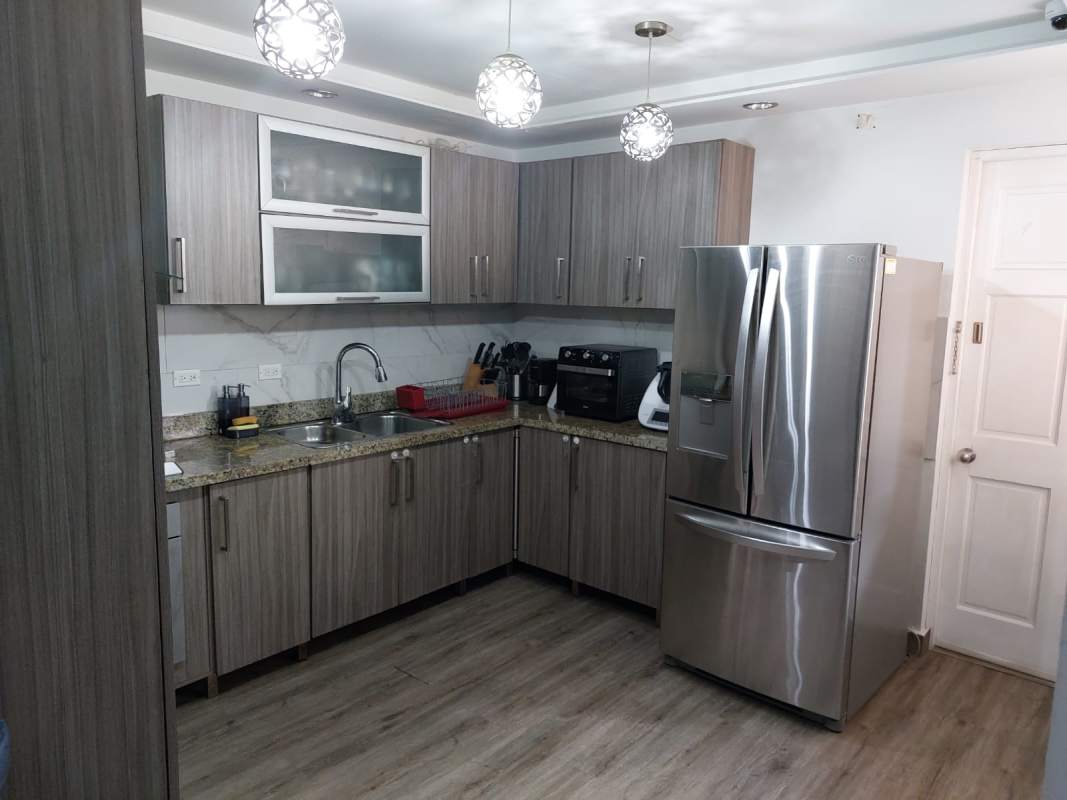 Bathroom with walk-in shower, modern fixtures, compact design in Villa Lucre duplex for sale