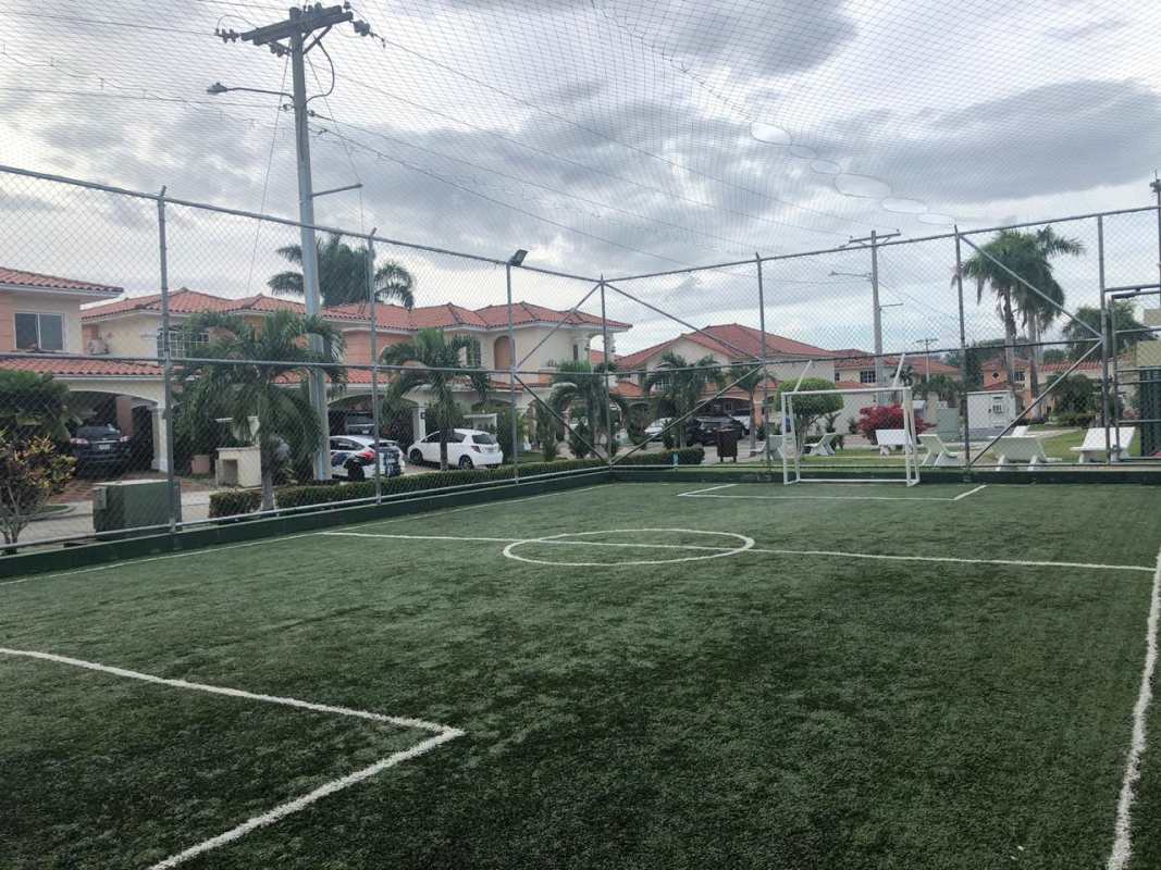 Covered patio with furniture and garden at Villa Valencia Costa Sur Panama