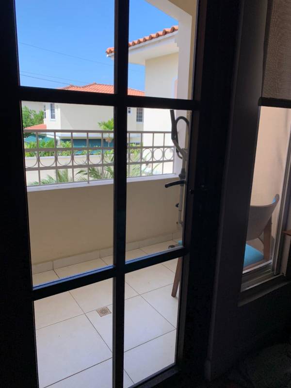 Balcony with metal railings overlooking neighborhood at Villa Valencia Costa Sur Panama