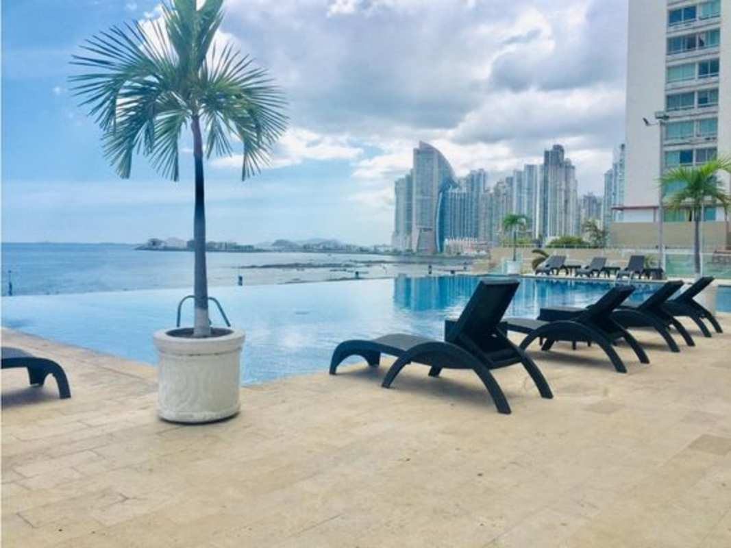 Modern kitchen with granite countertops and wooden cabinets in PH Portofino San Francisco Panama