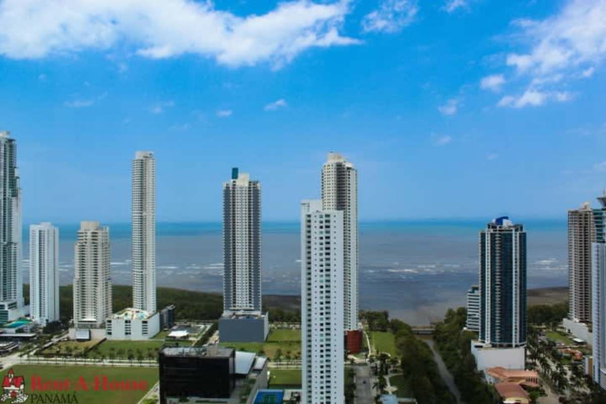 Spacious living area with panoramic windows, tiled floors, skyline views in Costa del Este new luxury apartment