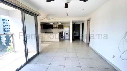 Kitchen with brown cabinets, granite-style counters and appliances in Panama Pacifico rental apartment