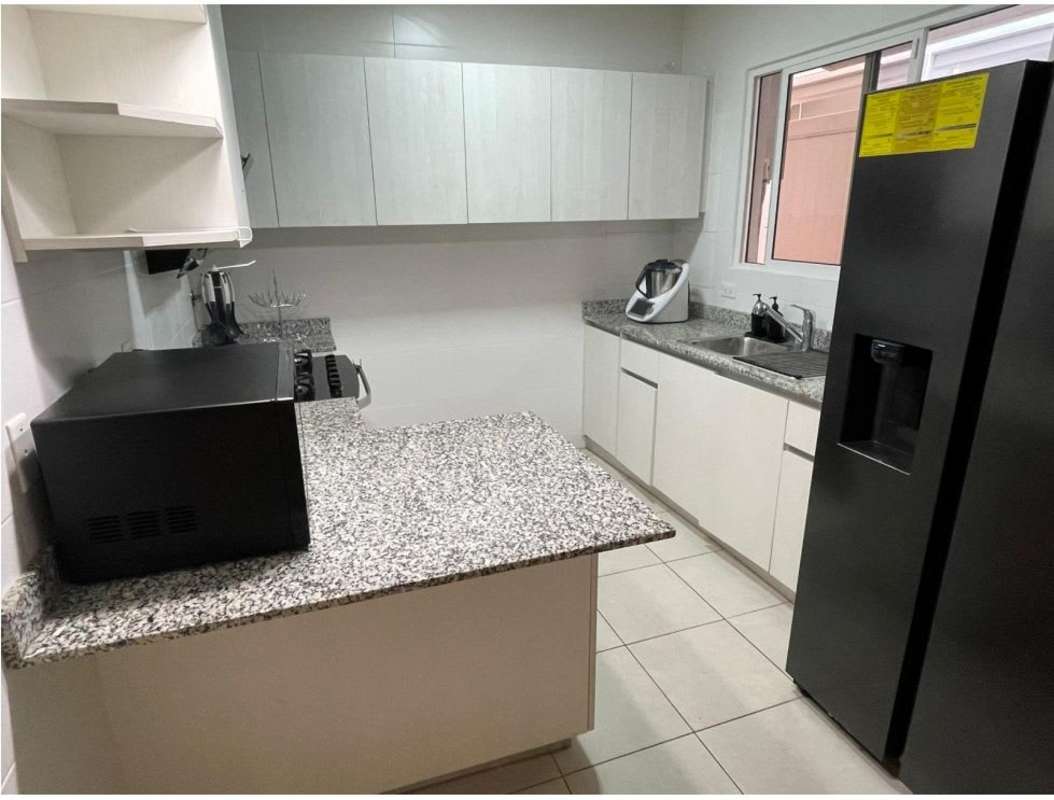 Covered terrace patio area for outdoor dining in gated community Brisas del Golf house for sale