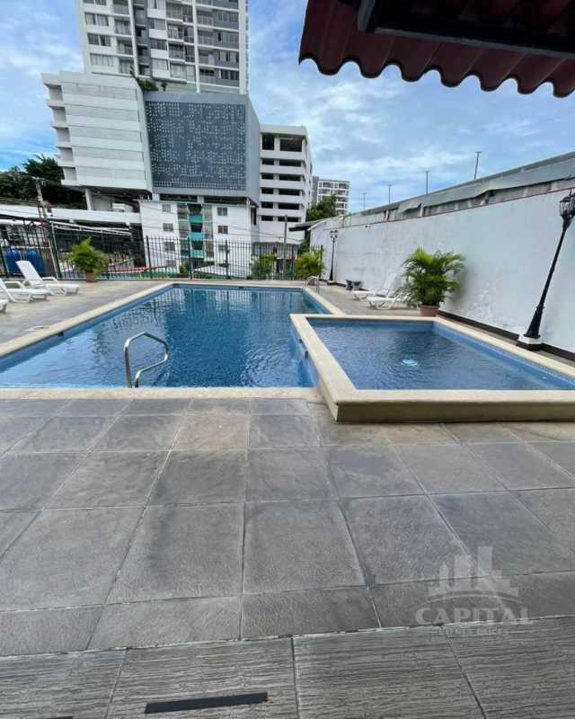 Swimming pool with sun deck and lounge chairs in PH Vista Marina Tower Panama City
