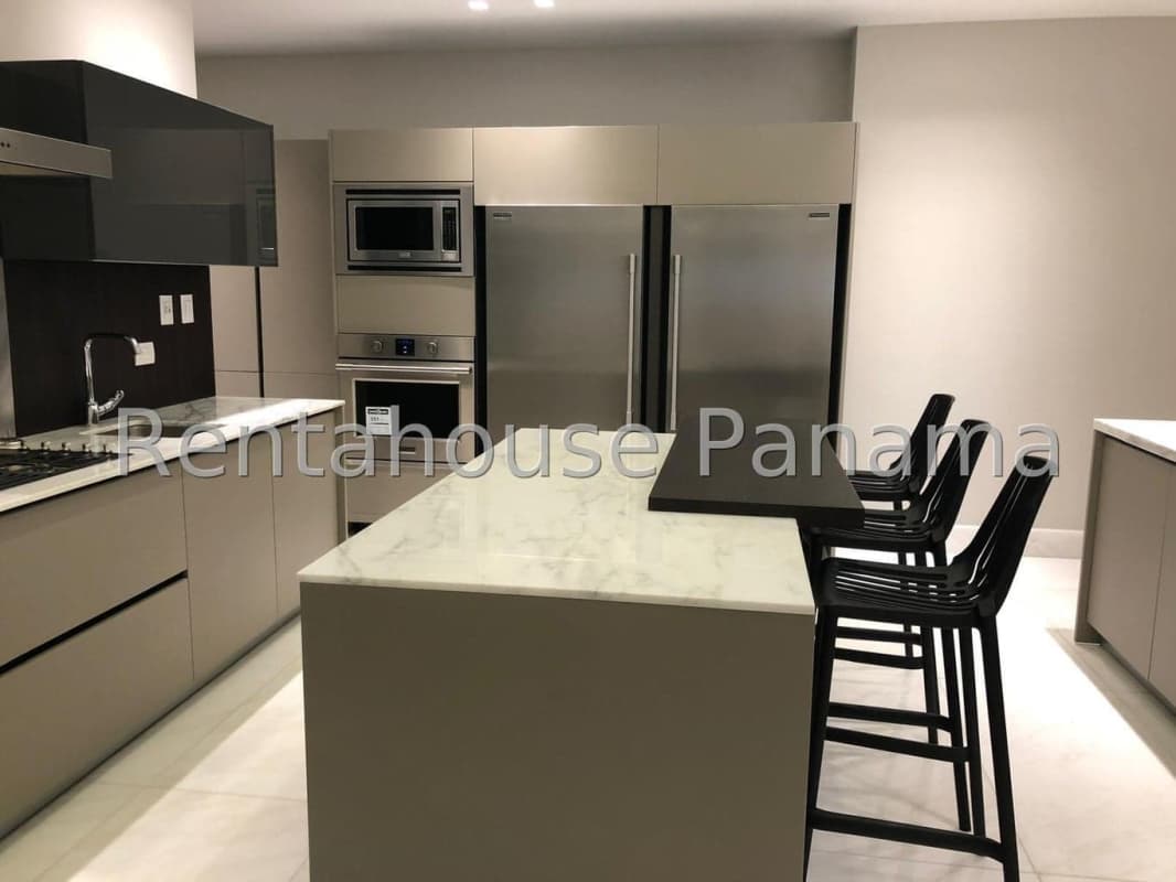 Chef’s kitchen with marble island, stainless appliances in oceanfront condo PH The Residences Panama City