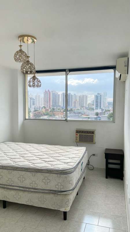 Kitchen with granite countertop, white cabinets, appliances in PH Park Place Panama