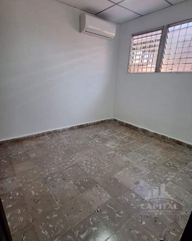 Open living room with ceramic tile floors, pendant lights, and window Don Bosco Panama