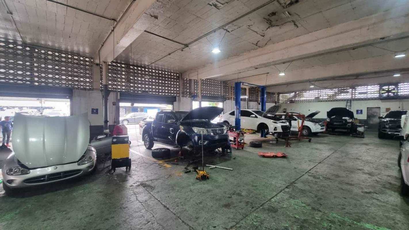 Facade of industrial warehouse garage in Parque Lefevre with open bays Panama City