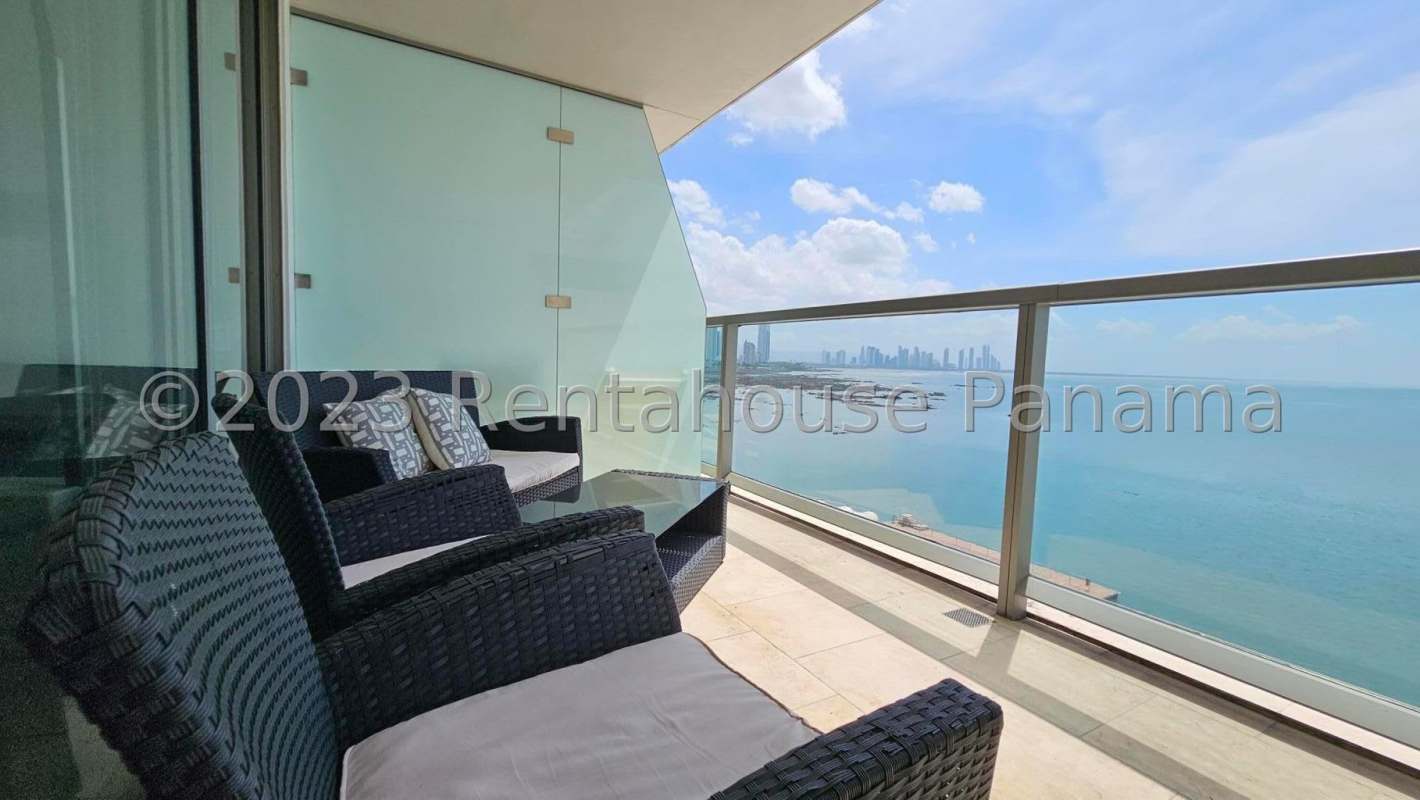 Balcony with glass railing overlooking ocean skyline PH TOC in Punta Pacífica Panama City