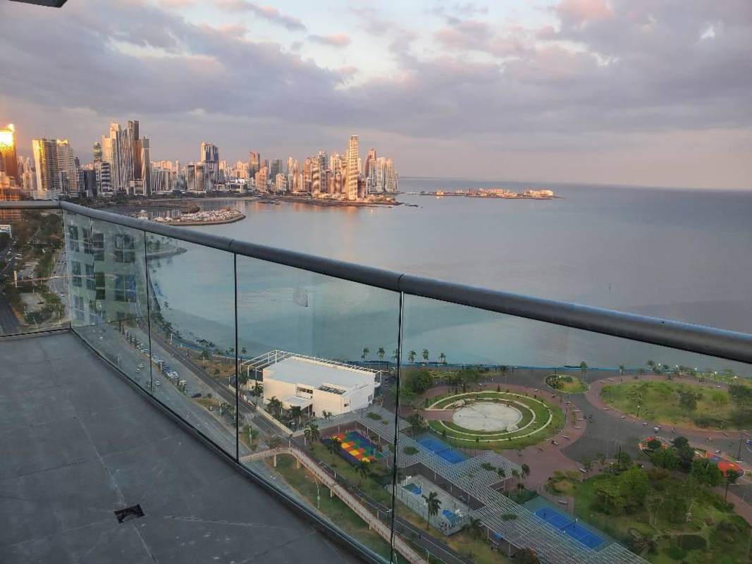 Modern apartment living room panoramic windows overlooking ocean at PH The Sands Panama