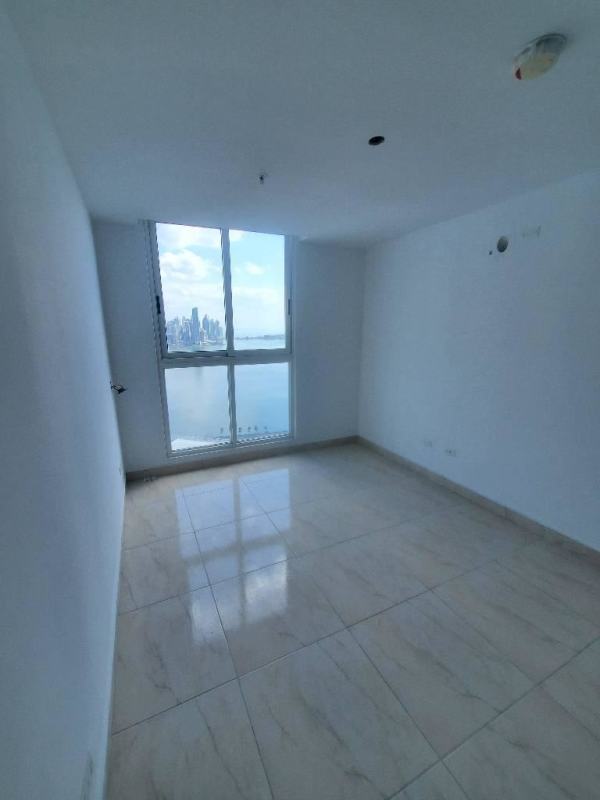 Large sliding glass doors connecting interior and balcony with ocean view PH The Sands