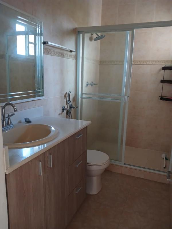 Master bedroom with large window, split AC, ensuite bathroom and closet in Costa del Este home for rent