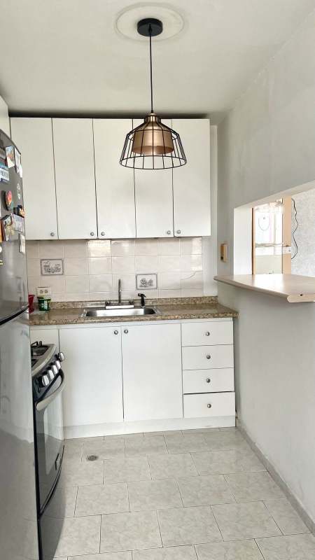 Living area with large windows, skyline view, modern decor in PH Parque Lefevre Panama