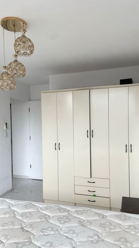 Compact kitchen granite countertop, white cabinets, pendant lighting PH Parque Lefevre Panama