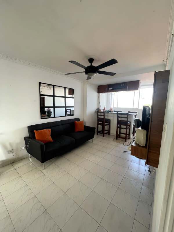 Living dining space with sofa, ceiling fan, window, and breakfast counter PH Plaza Bella Vista