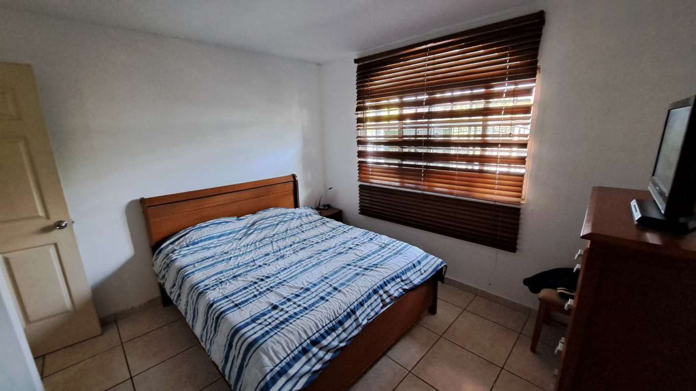 Bright kitchen with breakfast bar appliances window in house Panama Terrazas de Brisas del Golf