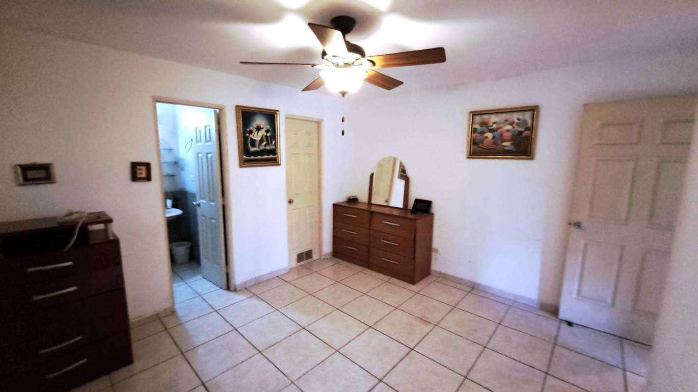 Open living dining area tray ceiling natural light house for sale Brisas del Golf Panama