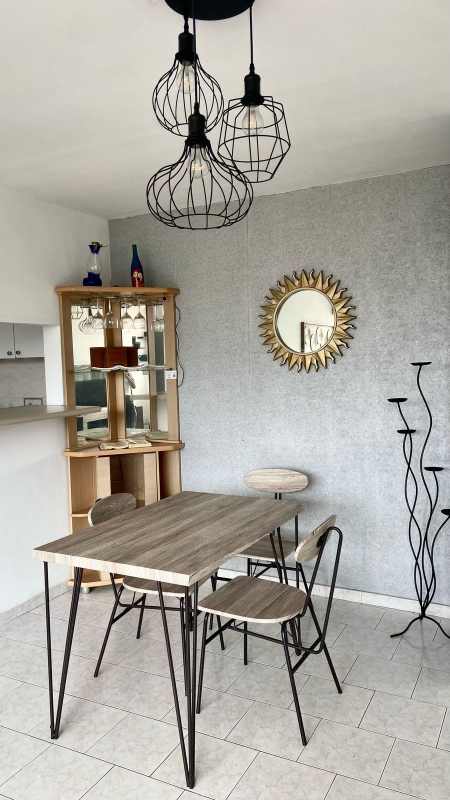Kitchen with white cabinets, granite countertop, and gas stove in PH Parque Lefevre Panama City