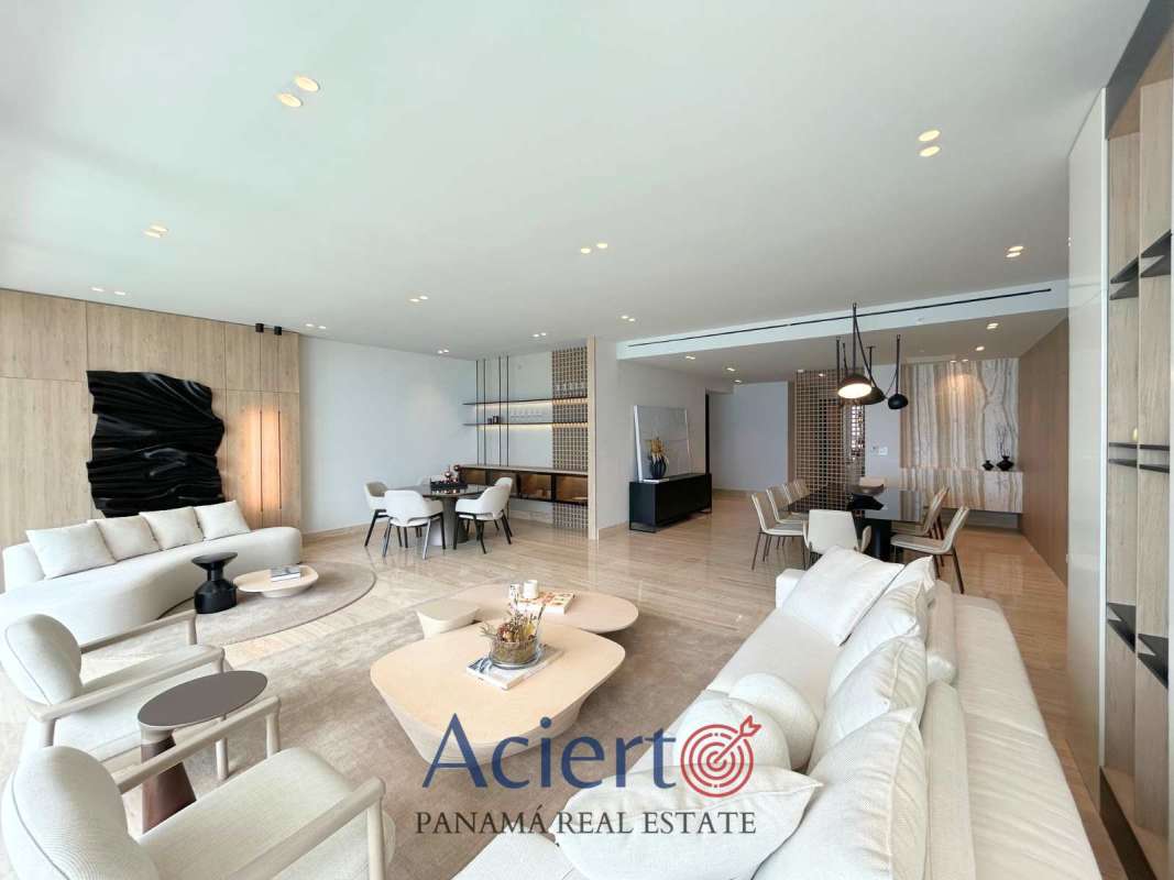 Bright den area with seating and city skyline view in PH Punta Paitilla luxury apartment