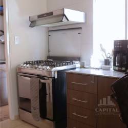 Dining room with wood table and natural light in Costa Verde La Chorrera Panama