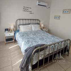 Minimalist bedroom with split AC, frosted glass closet, and tile floors Los Álamos Panama