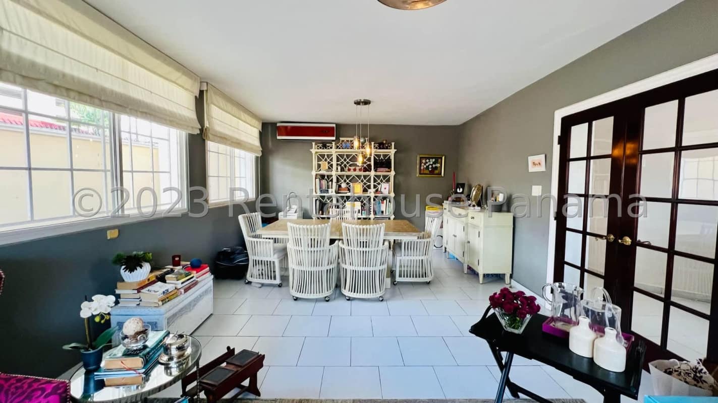 Remodeled traditional kitchen with wood cabinets, tiles and appliances in Altos del Golf Panama house