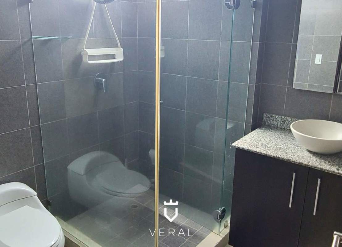 Bathroom with glass shower, marble floors and granite counters in PH Top Tower Panama City