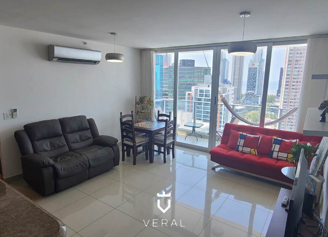 Spacious living room with marble floors, floor-to-ceiling windows, balcony access and skyline views in PH Top Tower Panama