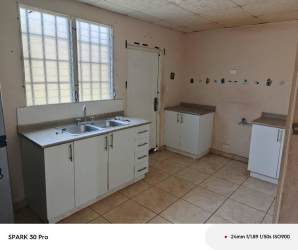 Bright minimalist kitchen with cabinets tiled floors family home in Arraiján Panama