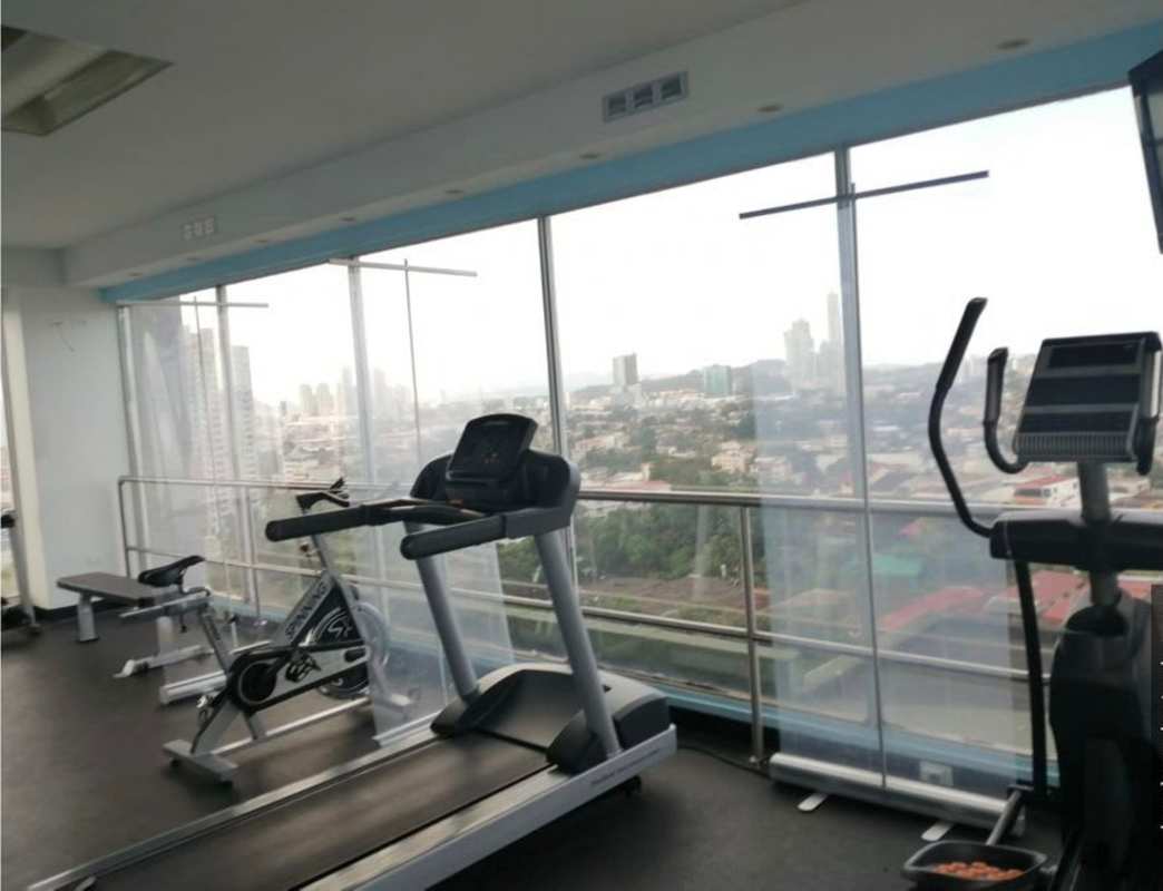 Modern gym with city panorama inside PH La Loma near Metro 12 de Octubre Panama