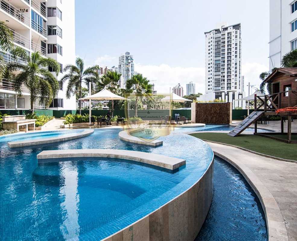 Outdoor pool, kids play area, palm trees at PH La Loma near metro Panama City
