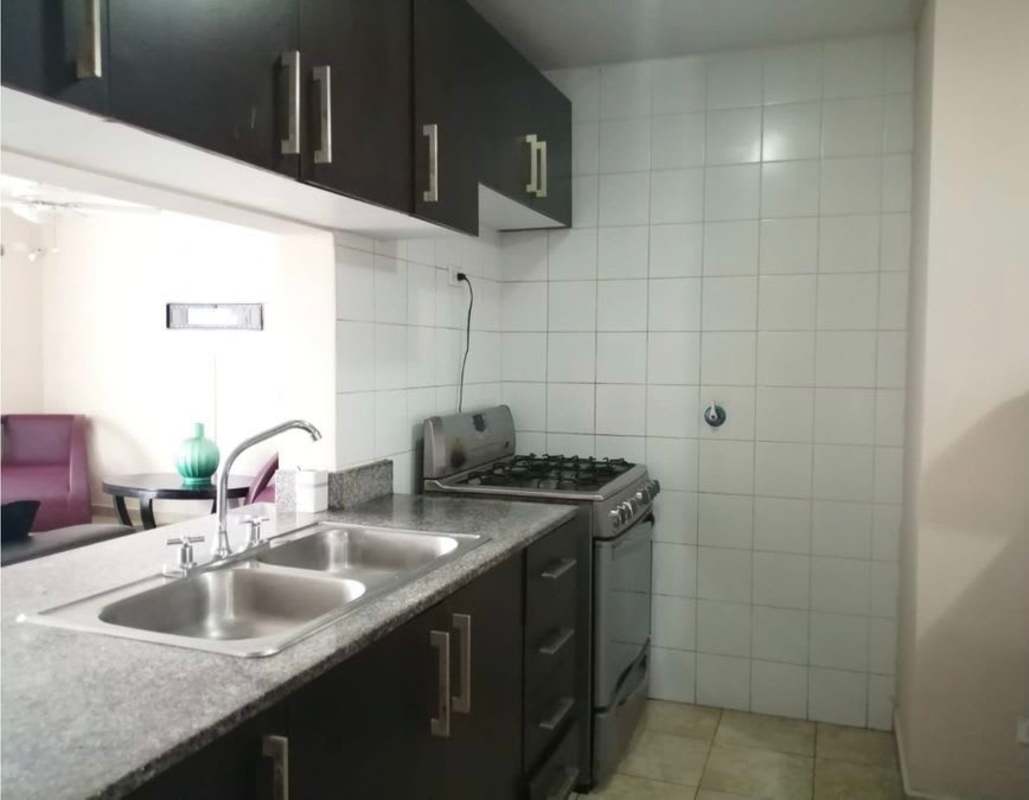 Kitchen with granite countertops, gas stove, and laundry space PH La Loma Panama City